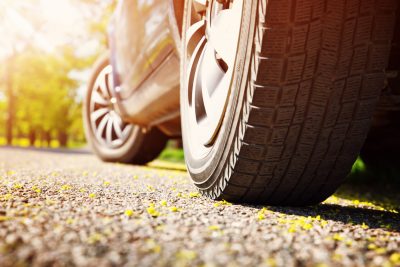 Car on asphalt road in summer